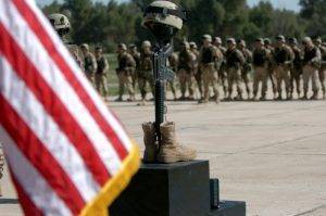 A memorial ceremony on a 3rd Infantry Division forward operating base for a soldier killed in action, Iraq 2005.